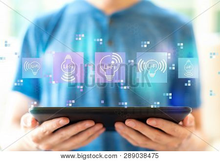 Lifi Theme With Young Man Using A Tablet Computer
