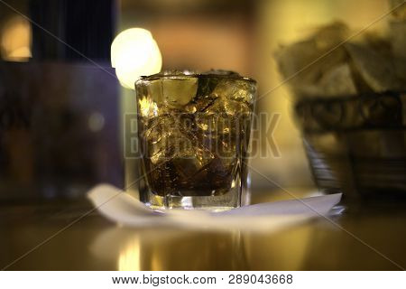 Drink On Ice With Chips In Background