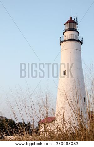Michigan Lighthouse In Vertical Orientation. The Fort Gratiot Lighthouse On The Shores Of Lake Huron