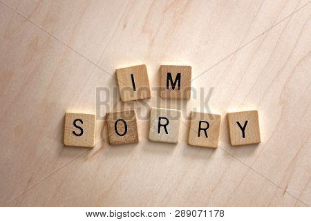 Words I'm Sorry Spelled Out In Wooden Letter Blocks On Wood Background.