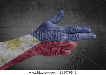Philippines Flag Painted On Male Hand Like A Gun