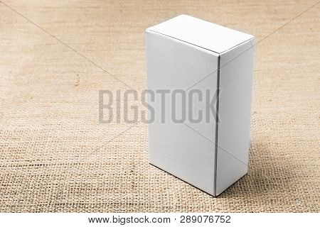 White Box Upright On Burlap On The Right