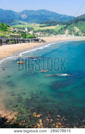 Cantabrian Sea Green Coast With Deba Town At Summer Day, Pais Vasco Spain