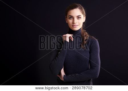 Beautiful Smiling Woman Posing At Isolated Black Background