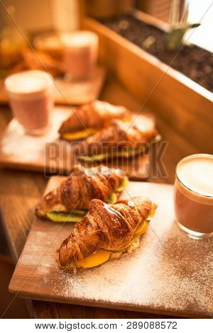 Fresh Croissant And Original Authors Coffee On Beet Milk With Fruits On Wooden Plate On Table. Healt