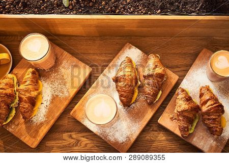 Fresh Croissant And Original Authors Coffee On Beet Milk With Fruits On Wooden Plate On Table. Healt
