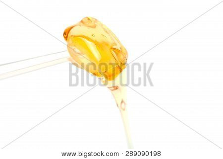 Sugar Paste For Shugaring Depilation On Stick Blue Background.