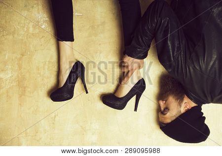 Funny Female Legs In Elegant, Fashion, Stylish, Black Shoes On High Heels Over Head Of Bearded Man O