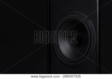 Black Music Speaker On A Black Isolated Background. Party Or Music Listening Concept.