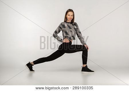 Indoor Shot Of Strong Athletic Woman Wearing Black Sports Outfit