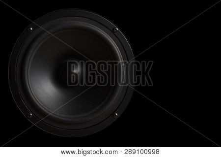 Black Music Speaker On A Black Isolated Background. Party Or Music Listening Concept.