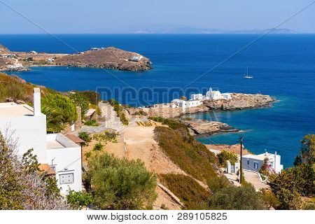 View Of Chrisopigi Monastery On South East Coastline Of Sifnos. Cyclades, Aegean Sea, Greece, Europe
