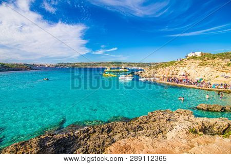 Comino, Malta - November, 2018: Tourists Crowd At Blue Lagoon To Enjoy The Clear Turquoise Water On