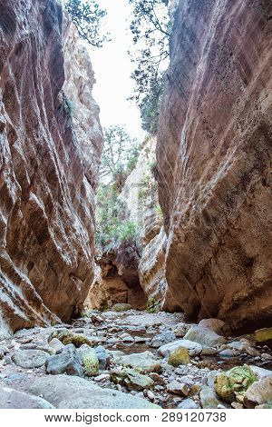 Stuck Hanging Stone In Avakas Canyon. Akamas Peninsula Landscape. Cyprus Landmark