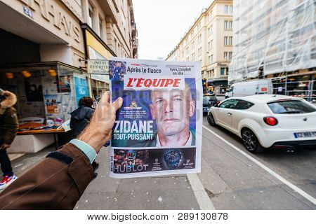 Paris, France - Mar 12, 2019: Man Pov At French Lequipe Team Sport Newspaper With Zinedine Zidane Ph