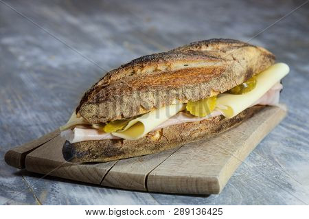 Ham And Cheese Sanwdich In A French Baguette, Made Of Paris Ham And Emmental With Some Sliced Pickle