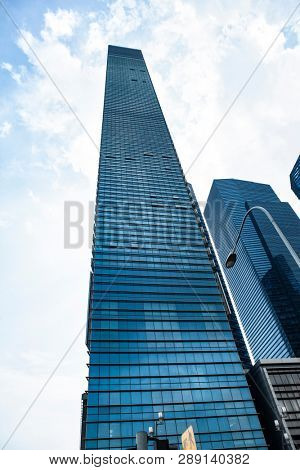 Commercial building in business disctrict of Singapore at noon