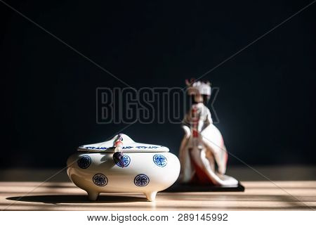 Close Up Of Japanese Incense Burner With Ceramic On Table