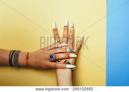 Woman Hands Holding Colorful Paper Copyspace Wearing A Lot Of Jewelry And Long Nails