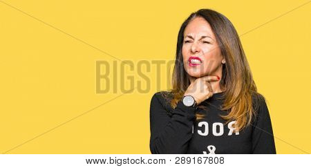Beautiful middle age woman wearing rock and roll sweater Touching painful neck, sore throat for flu, clod and infection