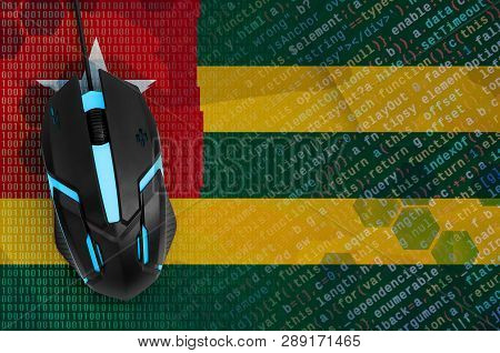 Togo Flag  And Computer Mouse. Digital Threat, Illegal Actions On The Internet
