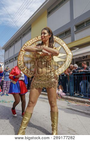 Xanthi, Greece - March 10 2019: Woman Leading Carnival Parade With Golden Painted Body.painted Skin 