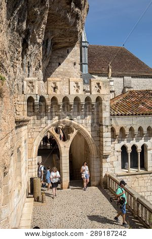 Rocamadour, France - September 3, 2018: Stone Walls Of Historic Basilica Of St-sauveur Blend Into Th