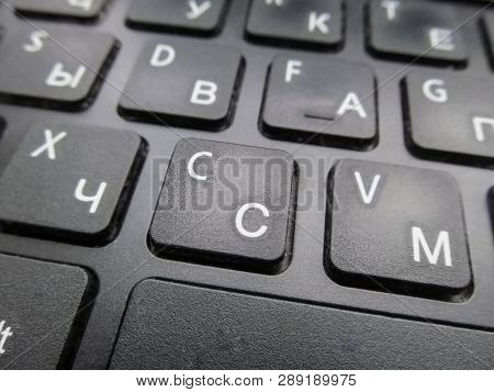 Fragment Of A Russian-english Laptop Keyboard, An Image With A Shallow Depth Of Field. Focus On The 