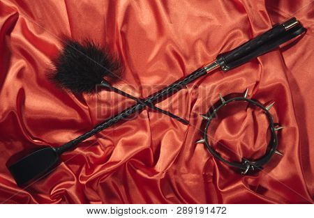 Bondage, Kinky Adult Sex Games, Kink And Bdsm Lifestyle Concept With A Whip, Feather Stick, Collar O