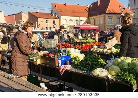 Zagreb, Croatia - December 29th 2018. A Stall Holder Waits For Customers At The Dolac Fresh Fruit An
