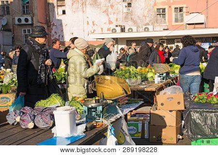 Zagreb, Croatia - December 29th 2018. Customers Shop For Fresh Fruit And Vegetables At The Dolac Mar