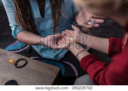 Top View Of A Nice Young Woman Showing Her Palms