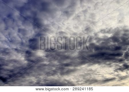 Beautiful Alto Cumulus Cloud Formations On A Deep Blue Sky