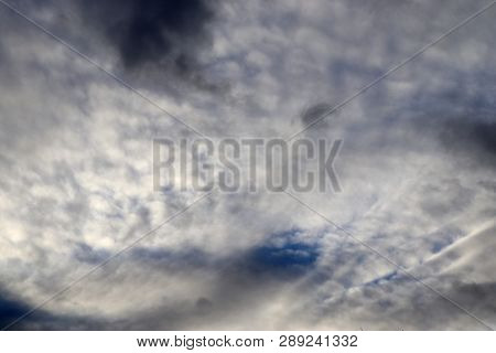 Beautiful Alto Cumulus Cloud Formations On A Deep Blue Sky
