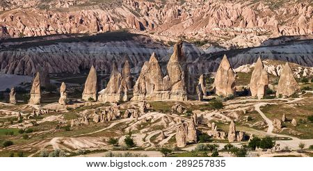 Panorama Of Amazing Sandstone Formations In Cappadocia, Turkey. View Of The Valley Near Goreme At Su