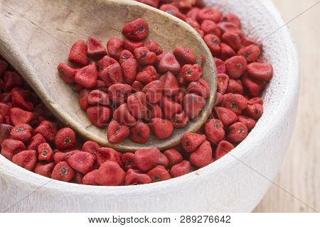 Annatto Beans In Bowl On The Table Seen From Up Close.