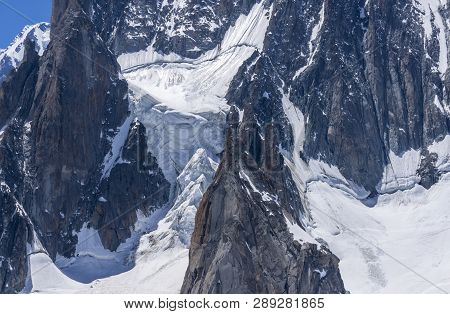Ice Snowy Seracs And Rocks In The Upper Parts Of The Mont Blanc Massif.