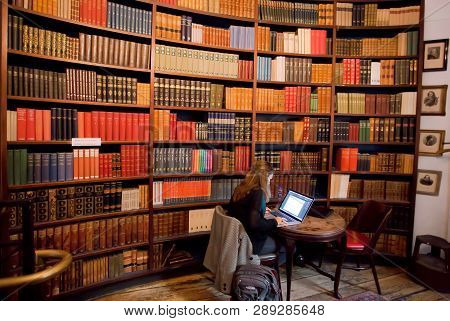 Copenhagen, Denmark - Sept 4: Bookstore With Student Working Under Laptop, And Many Vintage Science 
