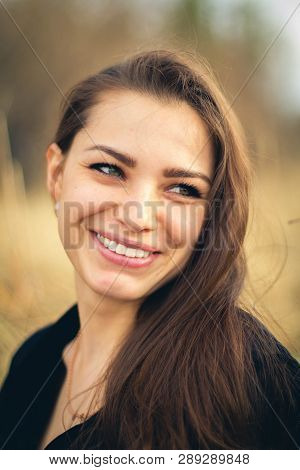 A Beautiful Brunette Girl Smiling. Autumn. Art Photo.