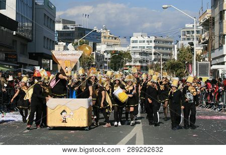 Limassol, Cyprus, March 10th, 2019: Group Of Beer Lovers In Carnival Costumes Walking Along Archbish