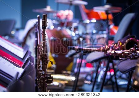 Saxophones Are On Stage. Intermission At The Concert, Close-up, Glare.