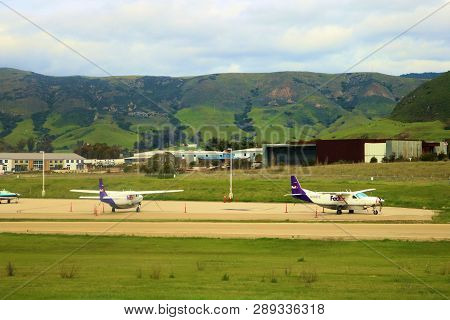 February 25, 2019 In San Luis Obispo, Ca:  Fed Ex Express Prop Planes Taxiing To The Cargo Facility 