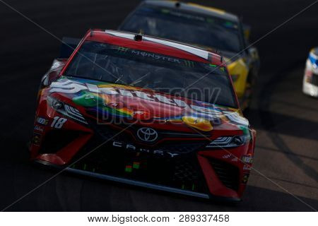 March 10, 2019 - Avondale, Arizona, USA: Kyle Busch (18) races down off the turn during the Ticket Guardian 500 at ISM Raceway in Avondale, Arizona.