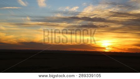 The Light Of The Sunrise In The  Desert