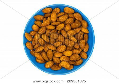 Almond Nuts In Blue Plate On White Background. Almond Nut Flat Lay. Almond Heap Top View. Tasty Heal