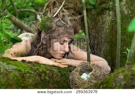 Dryad Guarding A Bird's Nest In The Woods