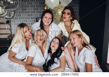 Beautiful And Positive Bide Mades Having Fun On Hen Party.