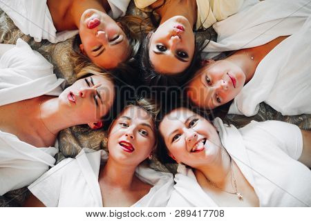 Beautiful And Positive Bide Mades Having Fun On Hen Party.