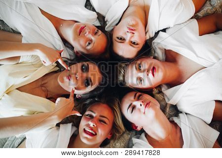 Beautiful And Positive Bide Mades Having Fun On Hen Party.