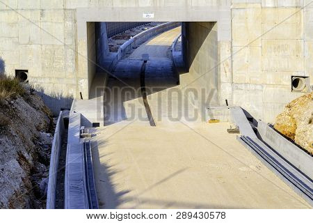 Underpass And Tunnel For The Construction Of A New Railway Line. Detail Of Sewage And Metal Lattice 
